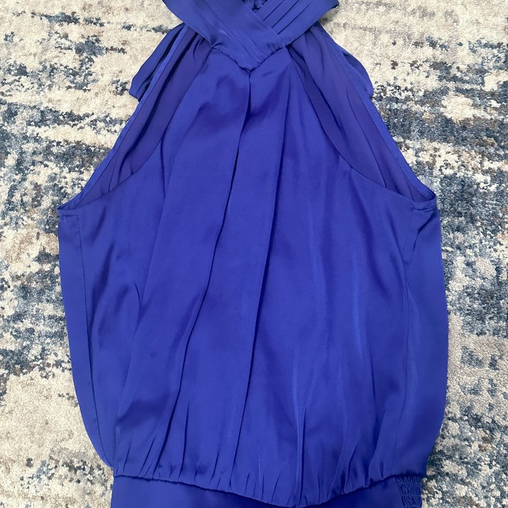 Silky beautiful blue halter top with open back and bow